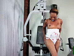 buxom black tgirl jacking in the gym