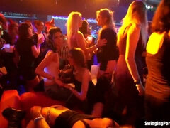 Watch these hot babes get wild in a club, playing with each other's soft bodies
