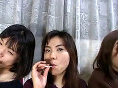 trio cute chinese femmes licking lollypops