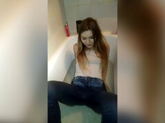 crazy Teen Girl Piss in her pants and comes in the bathtub with Clothes