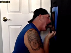 Closeup glory hole gay daddy sucking and jerking hard cock