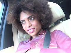 Curly Ebony babe welcomes white dude's rod in a car after a trip