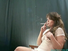 Smoking hot MILF indulges in self-pleasure, seductive posing, and smoking