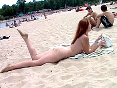 insatiable young nudists play with each other in sand