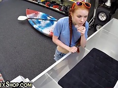 Sexy redhead bitch sucks a big white cock in a pawn shop