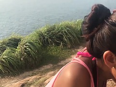 Thai amateur teen Cherry gives a quick blowjob to a guy on the beach
