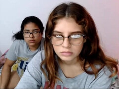 Two nerdy latinas playing with their pussies on cam
