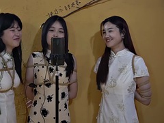 Three girls tied up singing