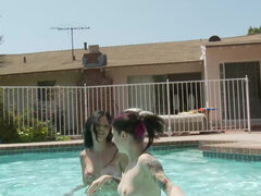 Britanny Lynn and Joanna Angel tease each other in the pool