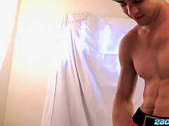 Twink strapped with christmas lights jacks his massive dick solo