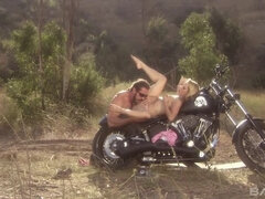 Lindsay Meadows has her pussy hammered on a motorcycle and swallows