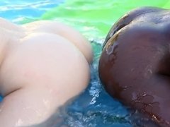 Interracial lesbian fun and games in the above ground pool