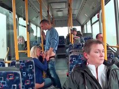 Backdoor sex is happening in the bus next to some people
