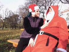 Santa Claus is celebrating Christmas with a brunette