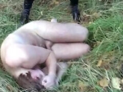 Submissive sex slave treated like a dog outdoors