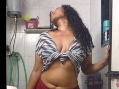 Watch this hot south Indian babe strip down to her tight red pants in the shower
