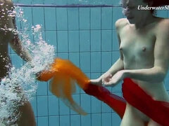 A pair of redheads swimming SUPER HOT!!!