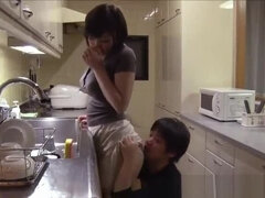 Asian Babe With Nice Ass And Big Tits Gives Tit Job And BJ In Kitchen