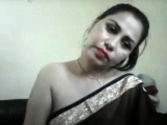 hot desi kitten on cam showing boobs and furthermore teasing in a saree wi