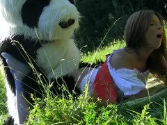A guy in a panda suit is ramming a sexy brunette with his purple rod