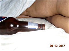 My husband putting bottles in my pussy