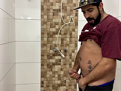 Squirting cum, bearded man with a cap alone in the bathroom having fun in the handjob until he cums a lot - Rodrik Dick