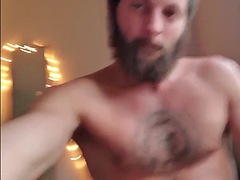 Bearded jock jerks off and fingers his oiled up ass for cum
