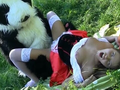 Dude in a panda suit is penetrating a busty dame in the field