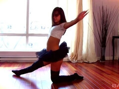Horny brunette in tutu does solo routine on the floor that ends in orgasm