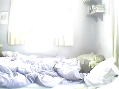 Wakes up & wanks on hidden cam.