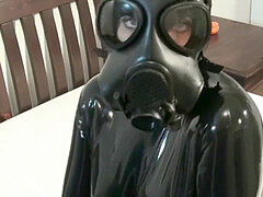 dame In 2 Layers Of latex Catsuits dark-hued + Transparent With Gas Mask + Piss
