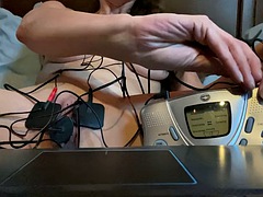 Sick slut plays with an electrical stimulator