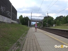 Blonde hottie caught peeing on the train platform & begs for a quickie