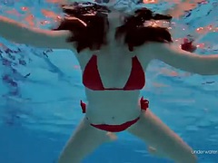 Beauty Katie in a red swimsuit with a thick pussy underwater