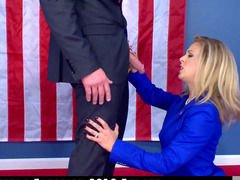 A blonde does a blow job during a political debate in this video