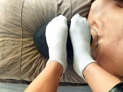 Dominant Nika indulges her filthy socks and foot aroma fetish by putting her feet on the slave