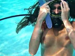 Underwater self-sex with a purple dildo from Nora Shmandora