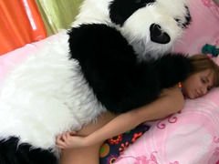 A babe with a sexy body is getting fucked by a large panda bear