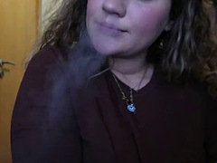 CLOSE UP CIGARETTE SMOKE BY A SEXY BLONDE WOMAN